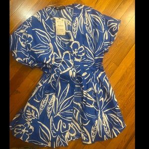 Blue and white dress with gold button